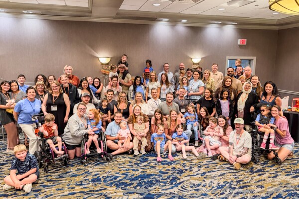 Families pose together at AHC Family Meeting